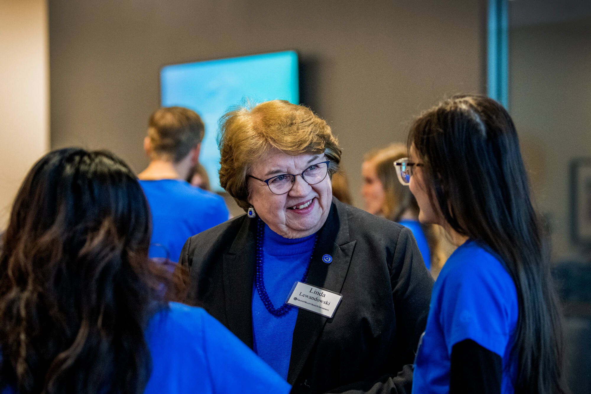 KCON Dean Linda Lewandowski, center, talks with nursing students.